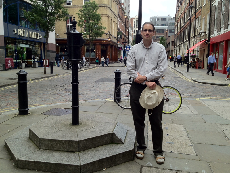 Photo of
              Andy standing by Broad Street commemerative pump