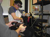 An Augmented Reality Training Environment for Post-Stroke Finger Extension Rehabilitation