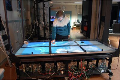 The OptIPortal, a scalable visualization, storage, and computing interface device for the OptiPuter