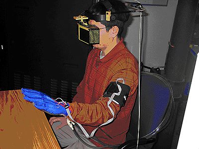 Subject using instrumentation developed to aid stroke impairment