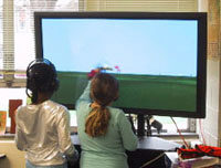 Two 3rd Graders exploring &lsquo;the Field&rsquo; on an ImmersaDesk