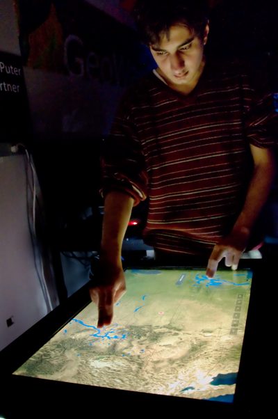 User Interacting with TacTile System (RainTable Application)