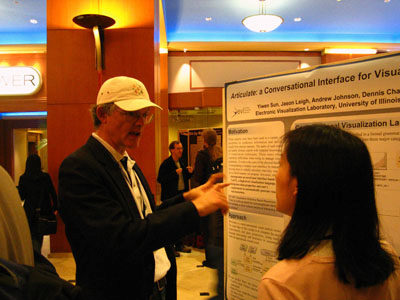 Yiwen Sun presenting poster to Dr. Jock Mackinlay at VAST 2009